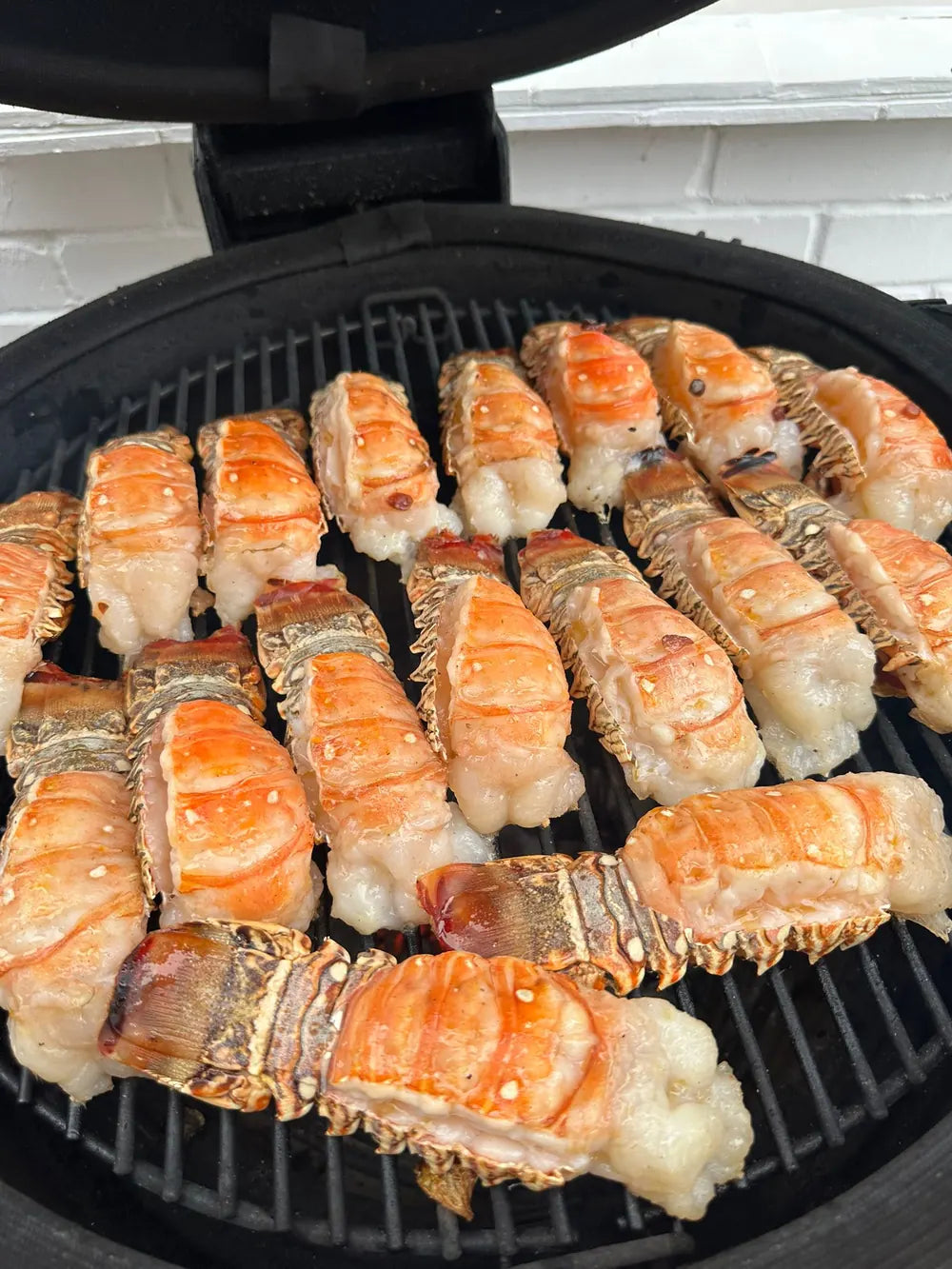 Lobster tails grilling for a corporate event at Goodwood