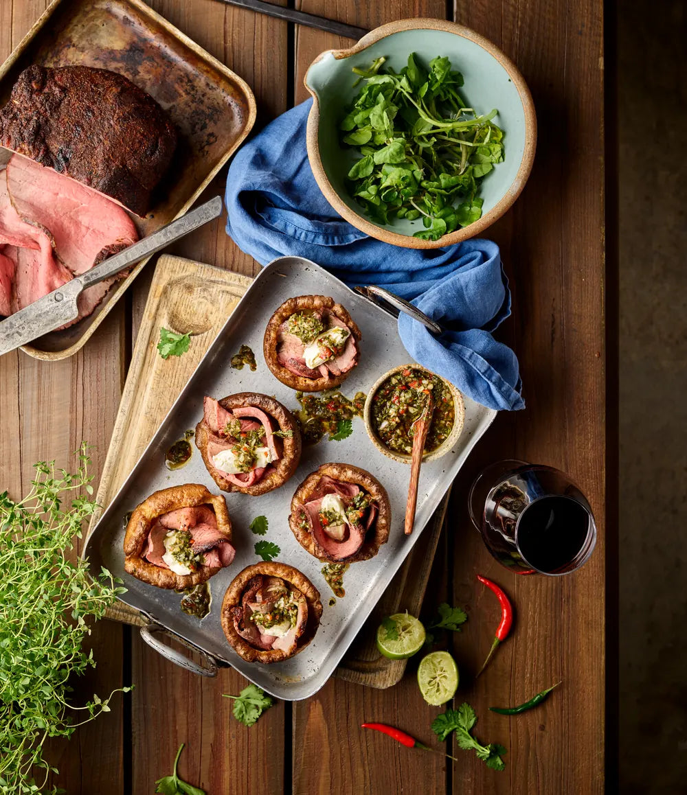 A tray of Yorkshire pudding canapés topped with rare roast beef