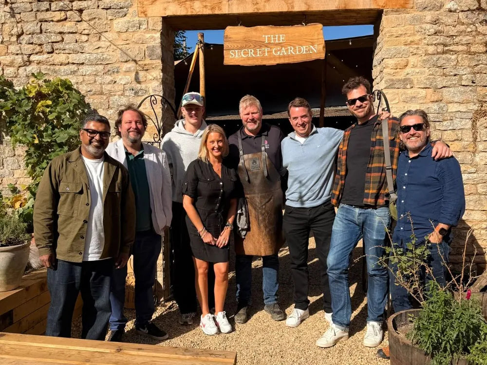 The Hoggy's Grill team and friends at the gate to The Bull and Swan's Secret Garden