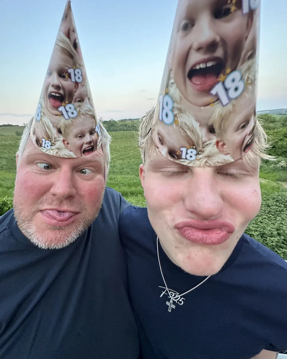 Hoggy and Ernie pulling faces in 18th birthday hats