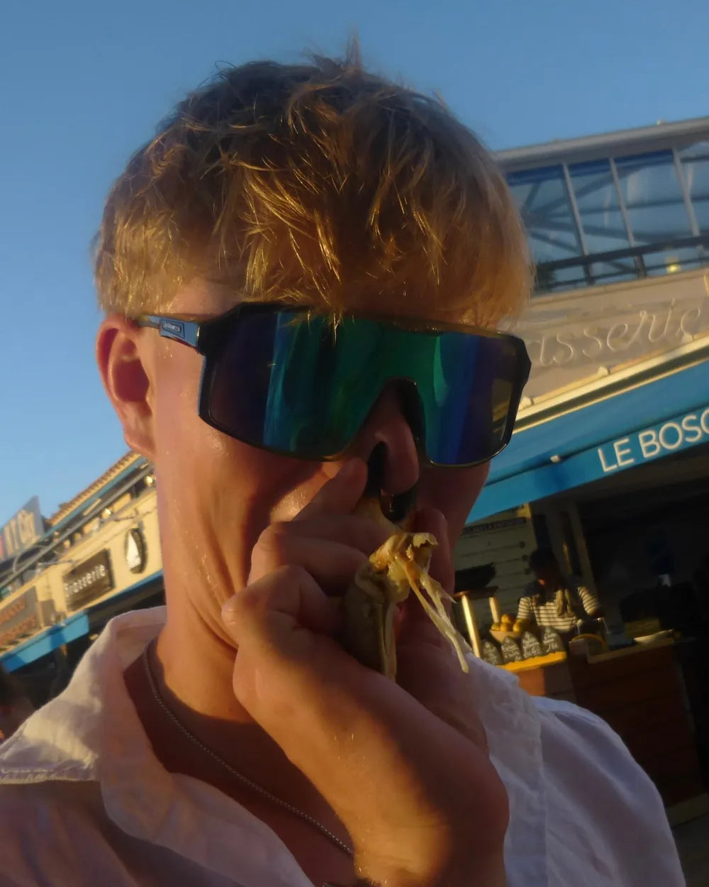 Ernie tucking in, in sunglasses
