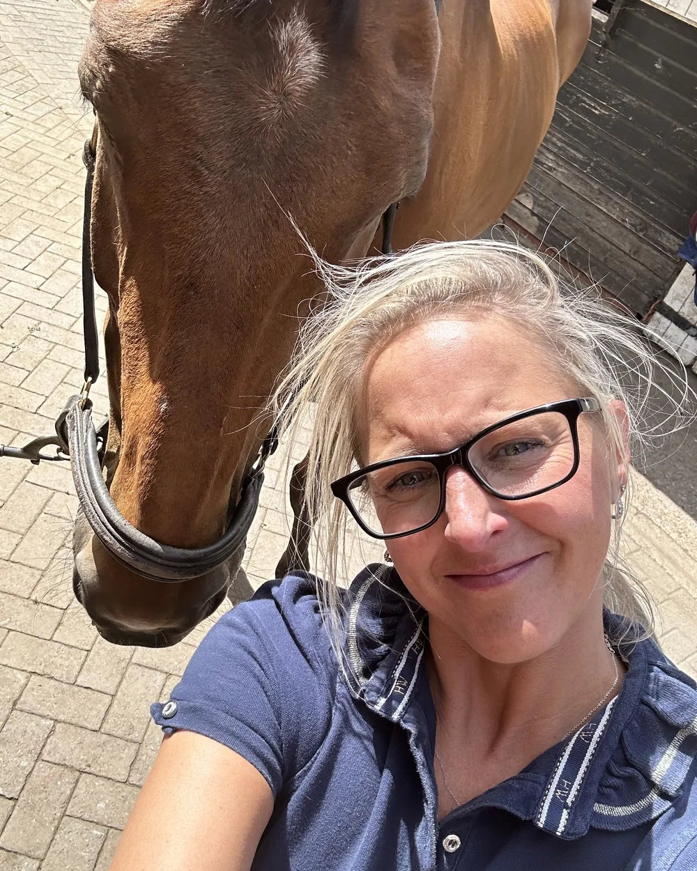 Sarah taking a selfie with a horse